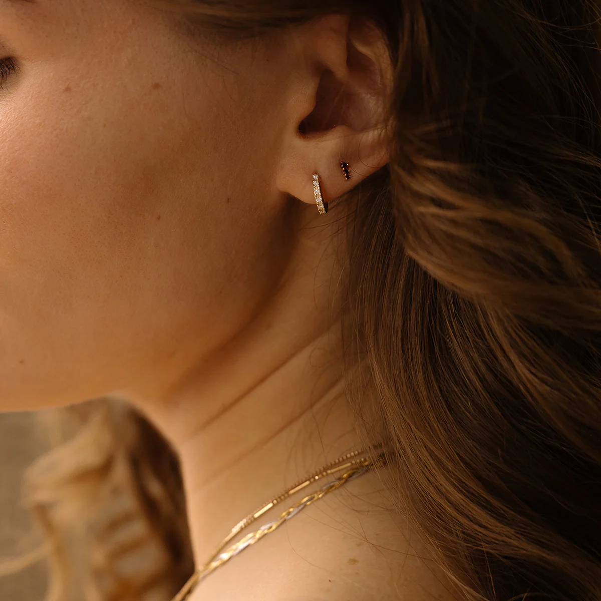Solid Gold Diamond Huggie Hoops - Image 3